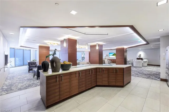 a room with lots of counter space and mirrors