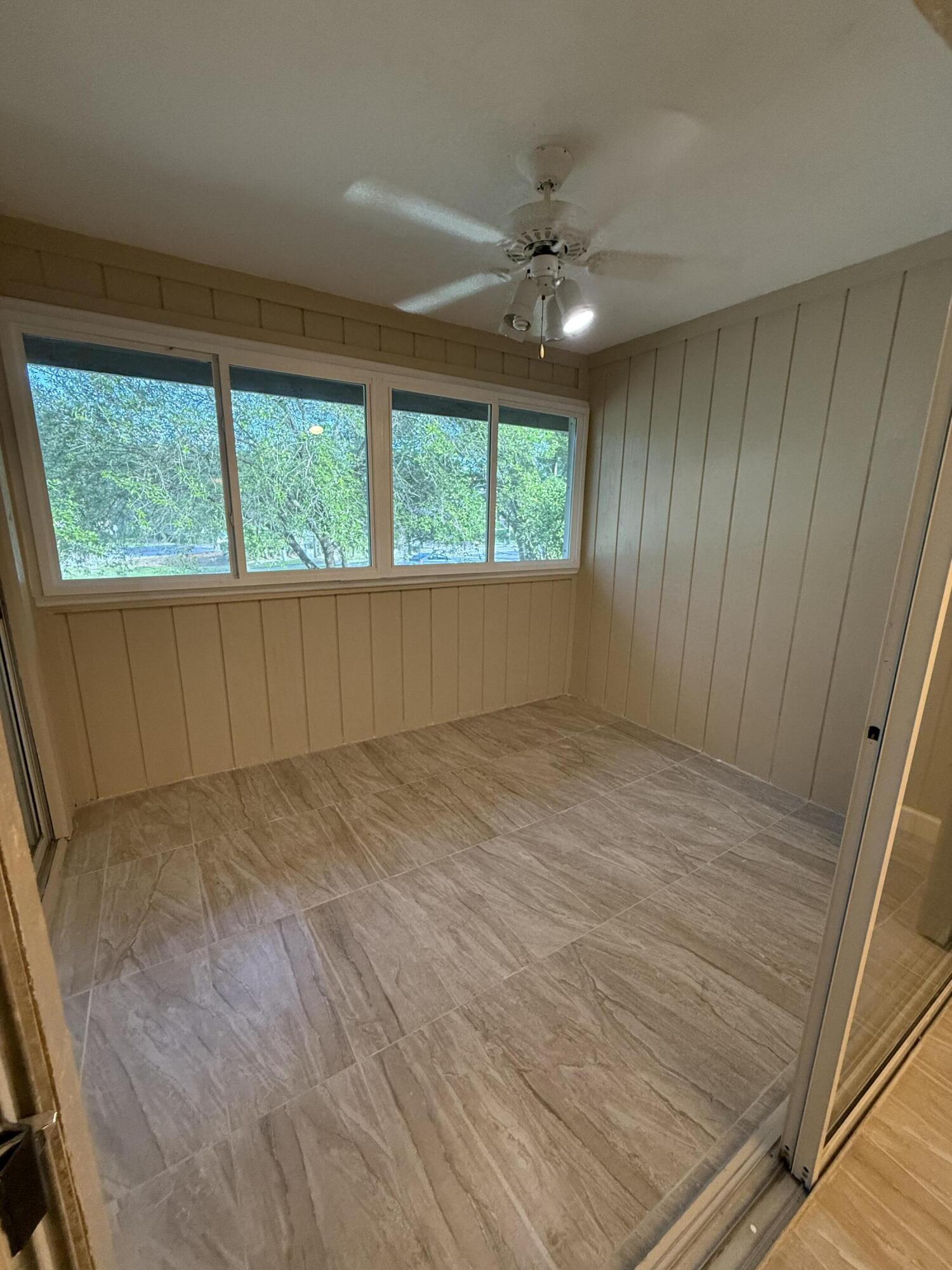 683 Post Oak Circle, Unit 105 Altamonte Springs, FL 32701 - Photo 15 of 22 wooden floor in an empty room with a window