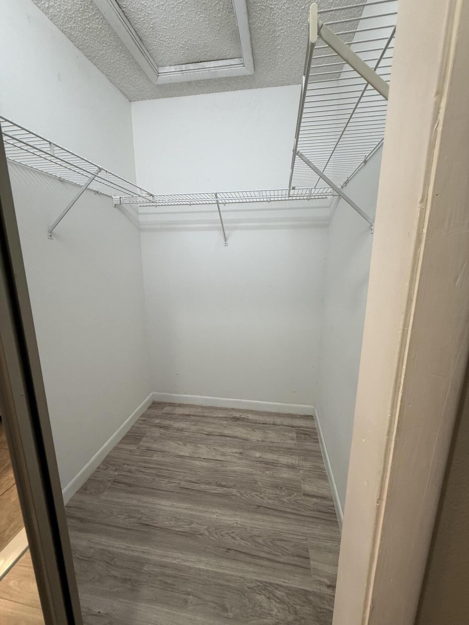 683 Post Oak Circle, Unit 105 Altamonte Springs, FL 32701 - Photo 20 of 22 a view of a room with racks on the wall