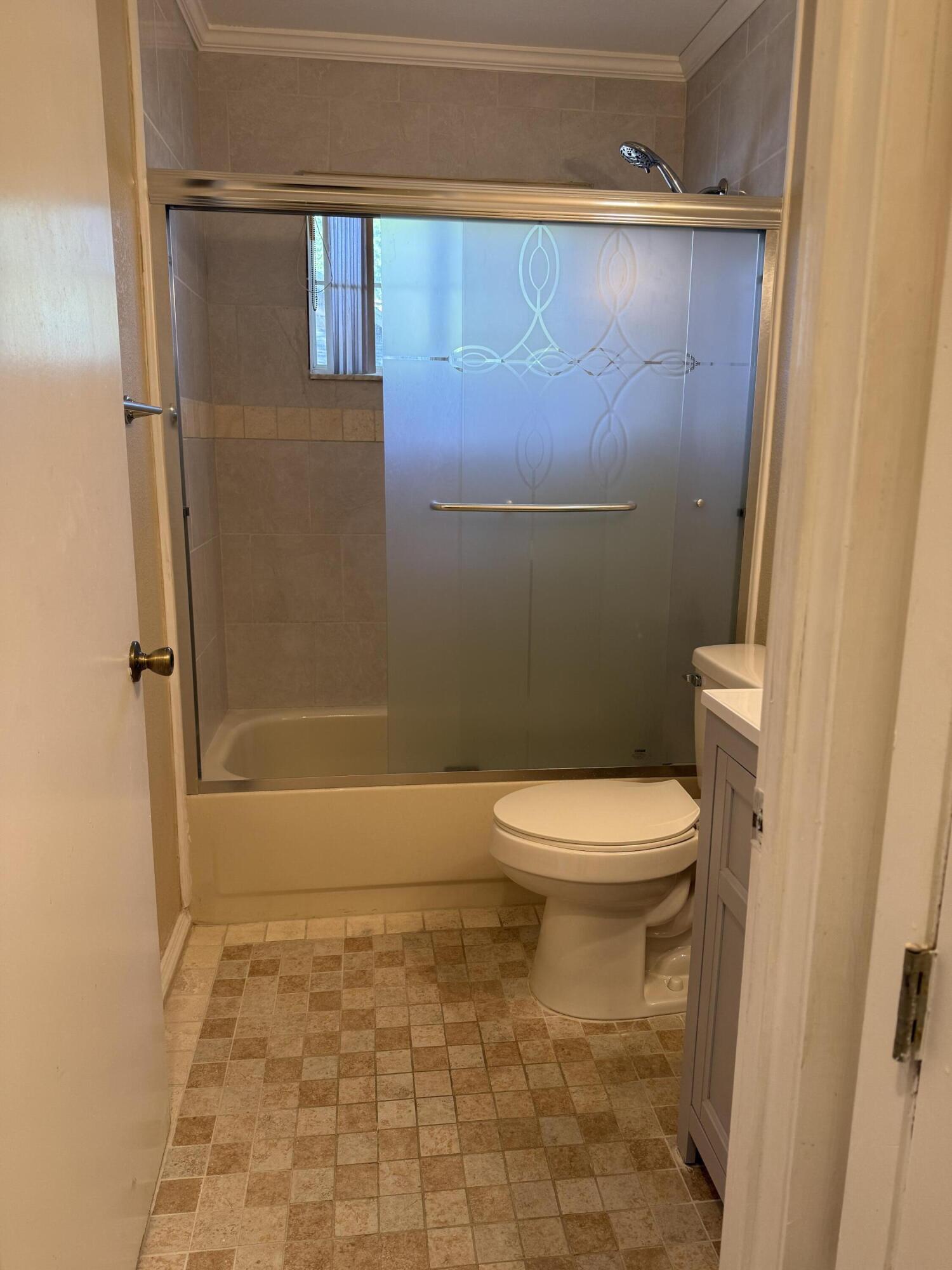 683 Post Oak Circle, Unit 105 Altamonte Springs, FL 32701 - Photo 8 of 22 a bathroom with a toilet and a shower