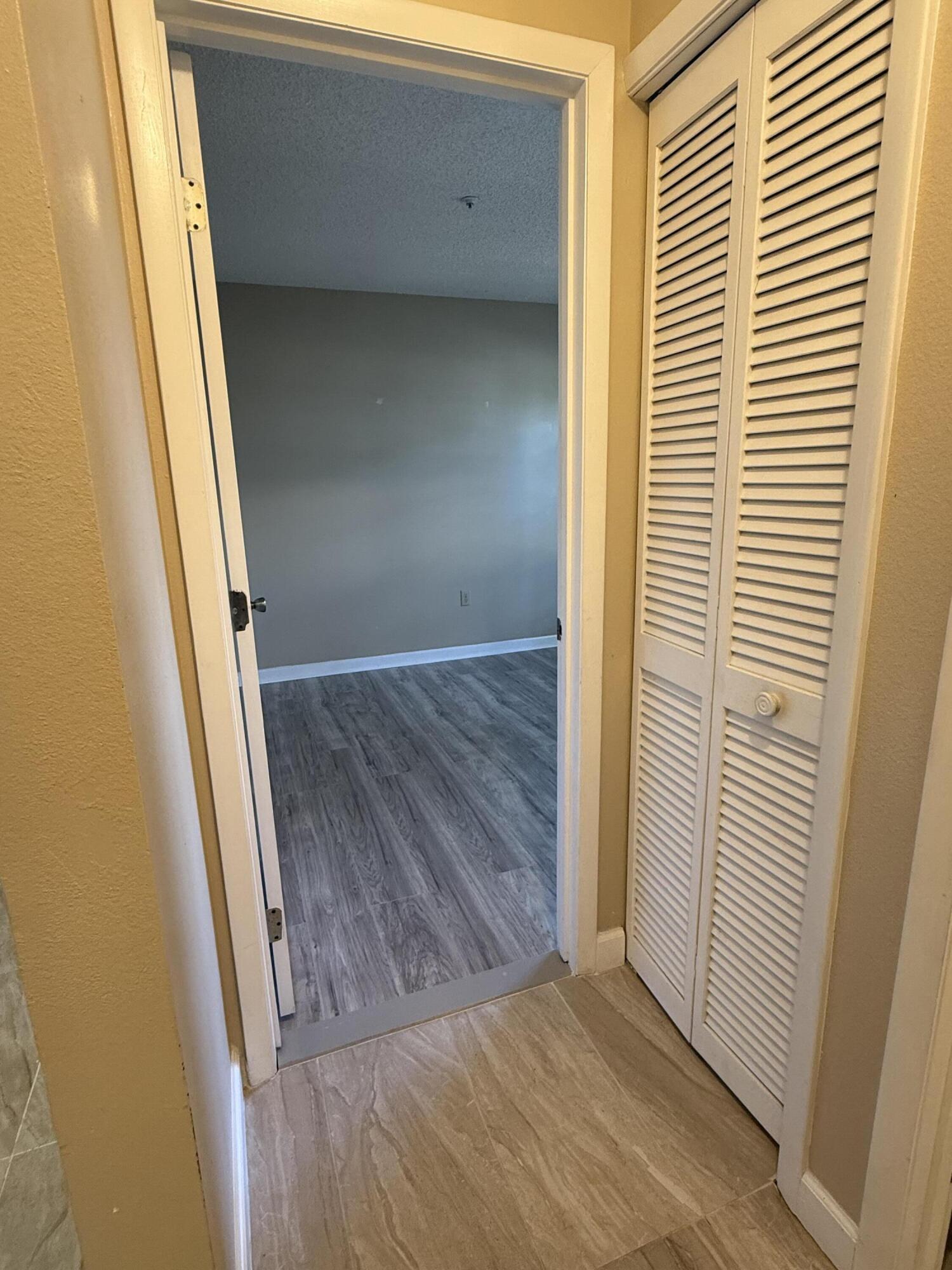 683 Post Oak Circle, Unit 105 Altamonte Springs, FL 32701 - Photo 10 of 22 a view of front door with wooden floor