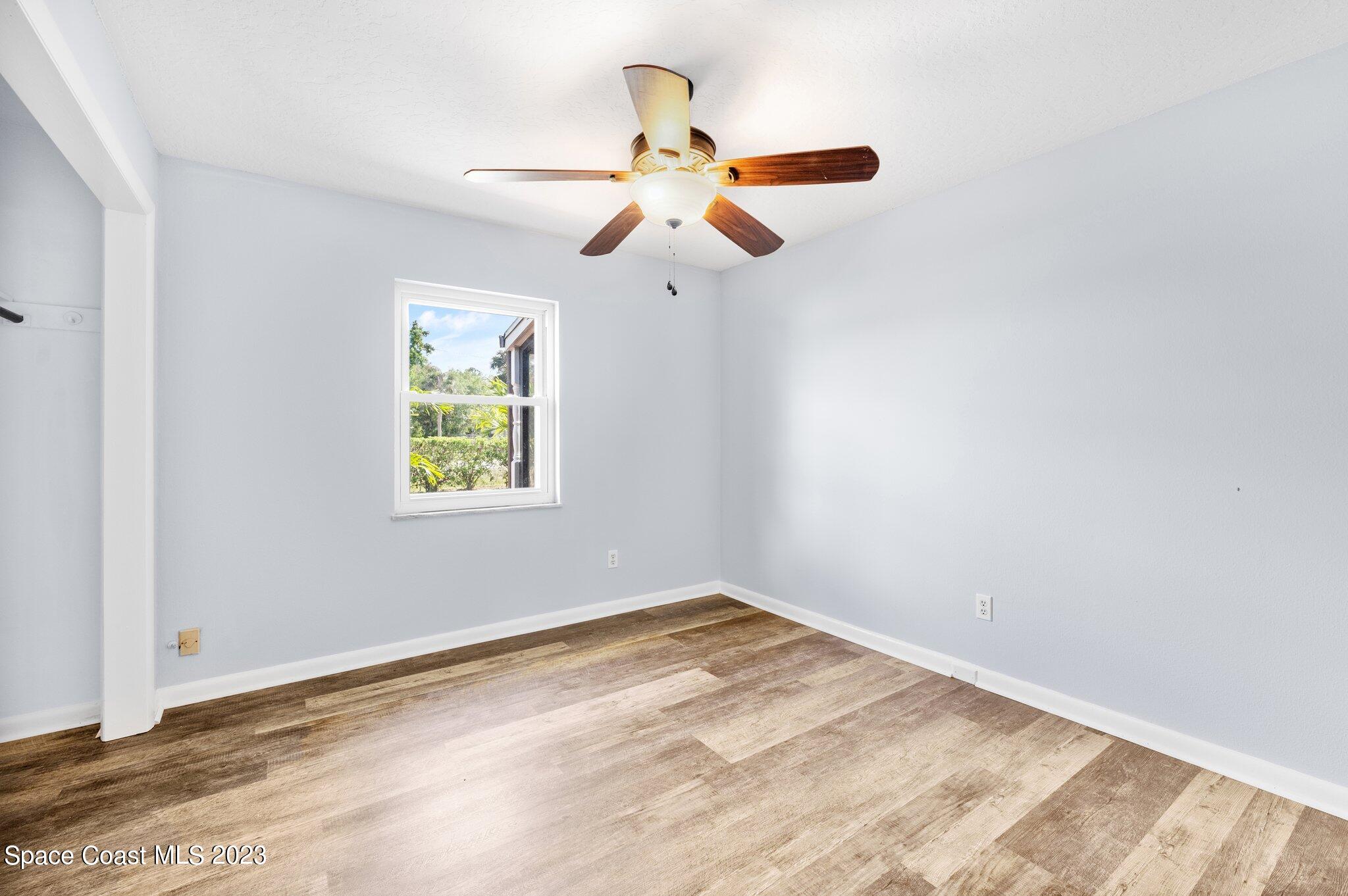 3030 Hield Road Melbourne, FL 32904 - Photo 12 of 36 a view of empty room with window and ceiling fan