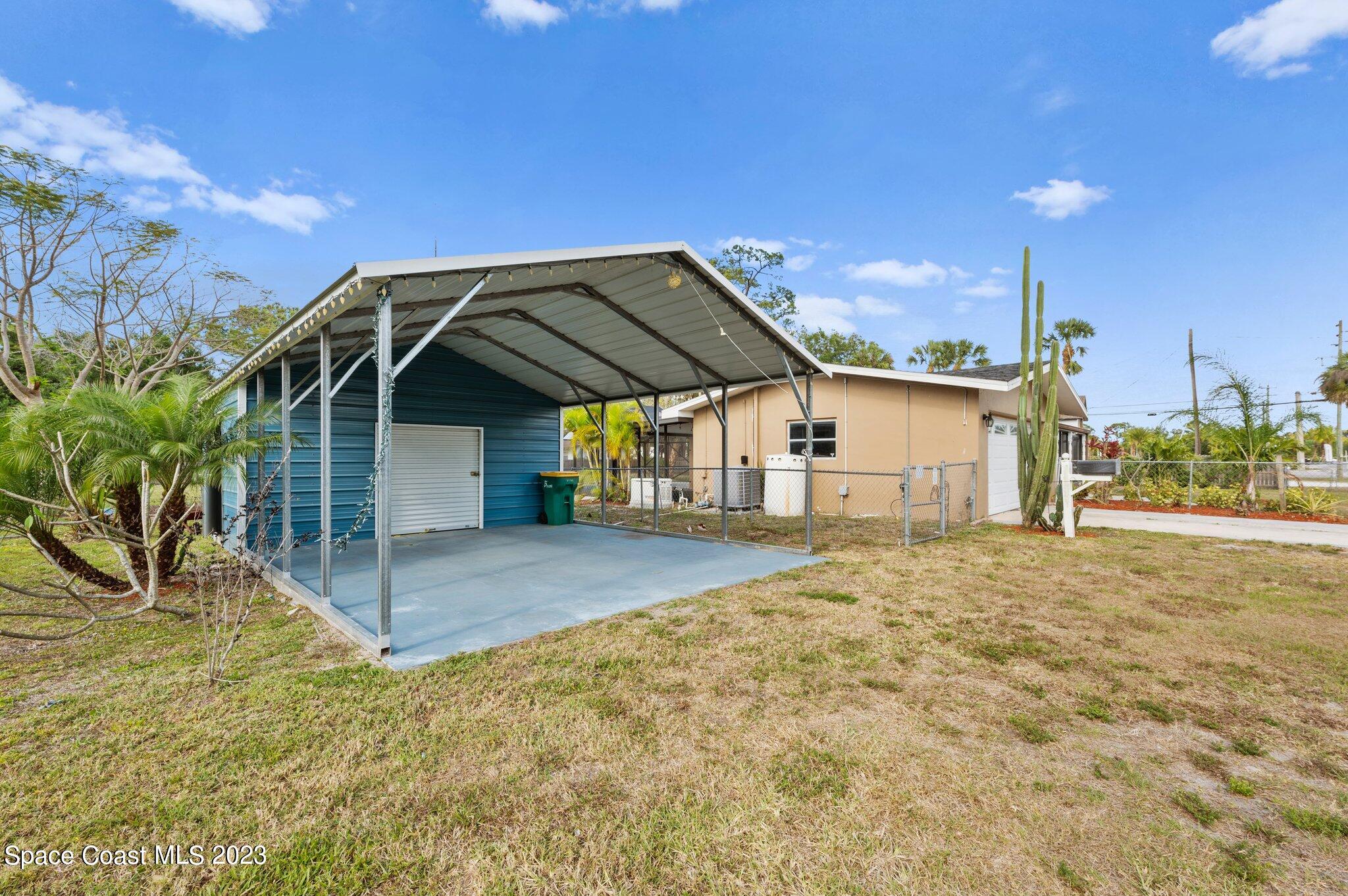 3030 Hield Road Melbourne, FL 32904 - Photo 21 of 36 a view of a house with a outdoor space