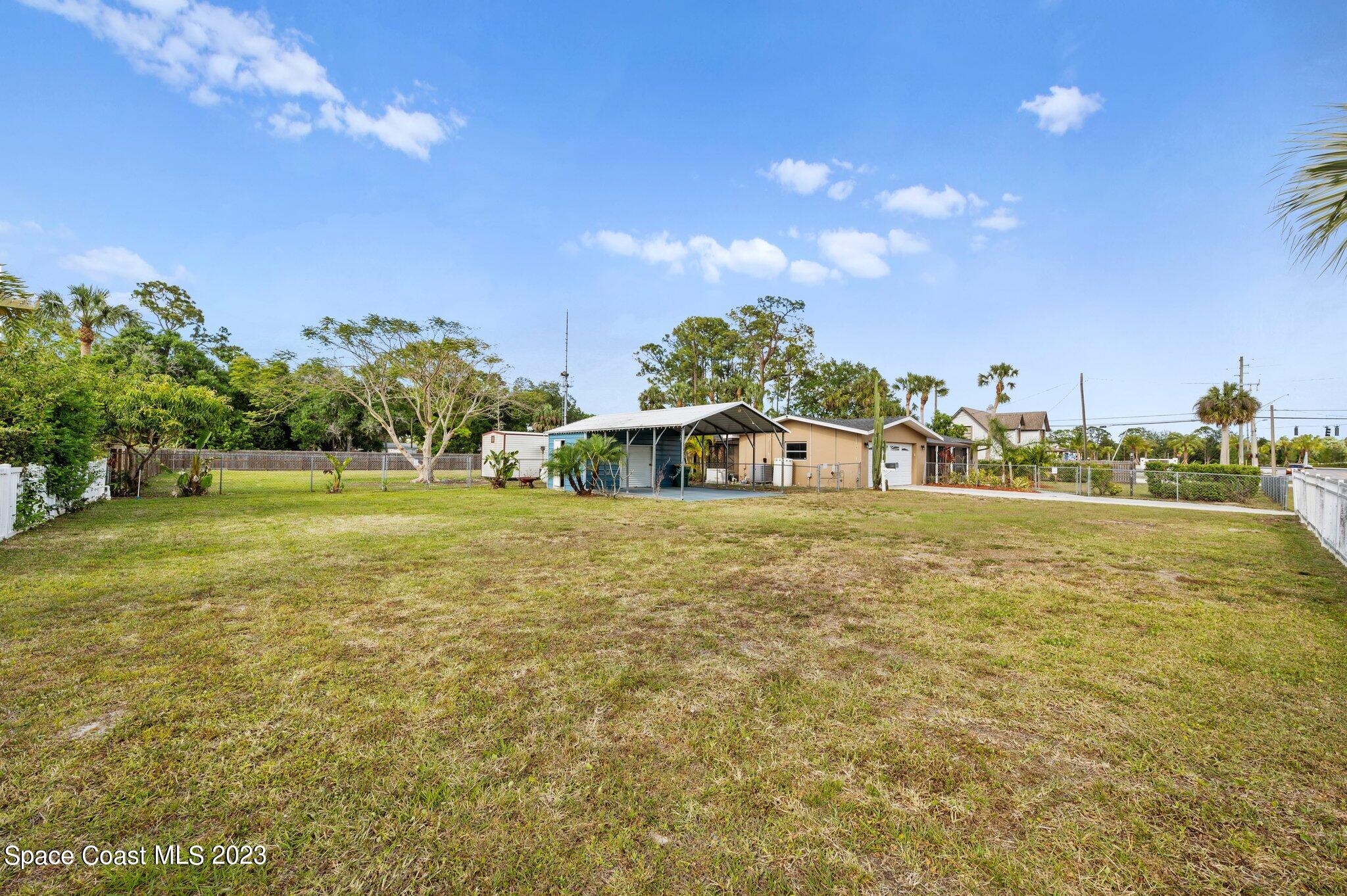 3030 Hield Road Melbourne, FL 32904 - Photo 22 of 36 a large body of water with a building in the background