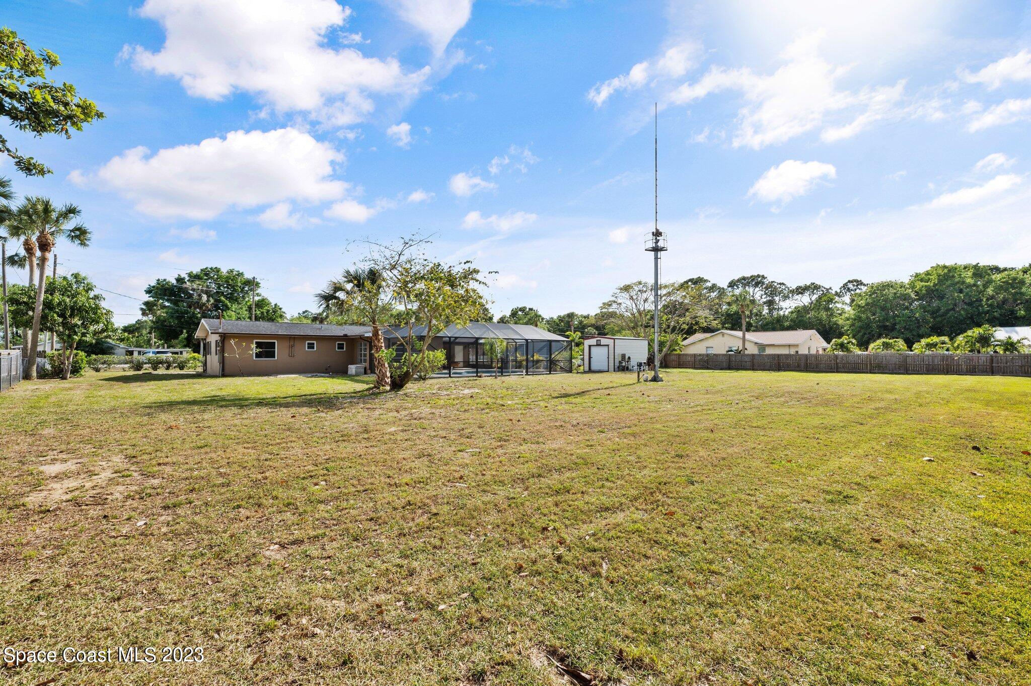 3030 Hield Road Melbourne, FL 32904 - Photo 25 of 36 a house view with swimming pool