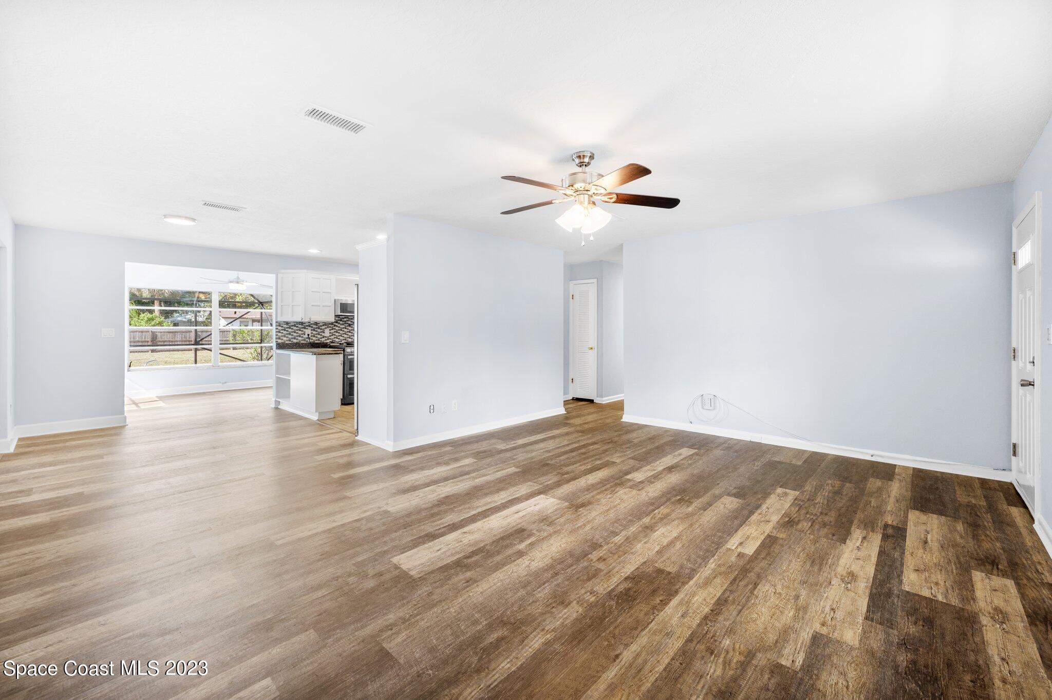 3030 Hield Road Melbourne, FL 32904 - Photo 5 of 36 a view of empty room with wooden floor