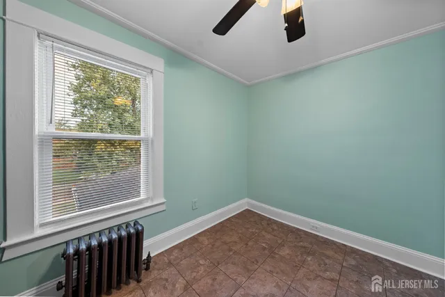 a view of a room with window and hardwood floor