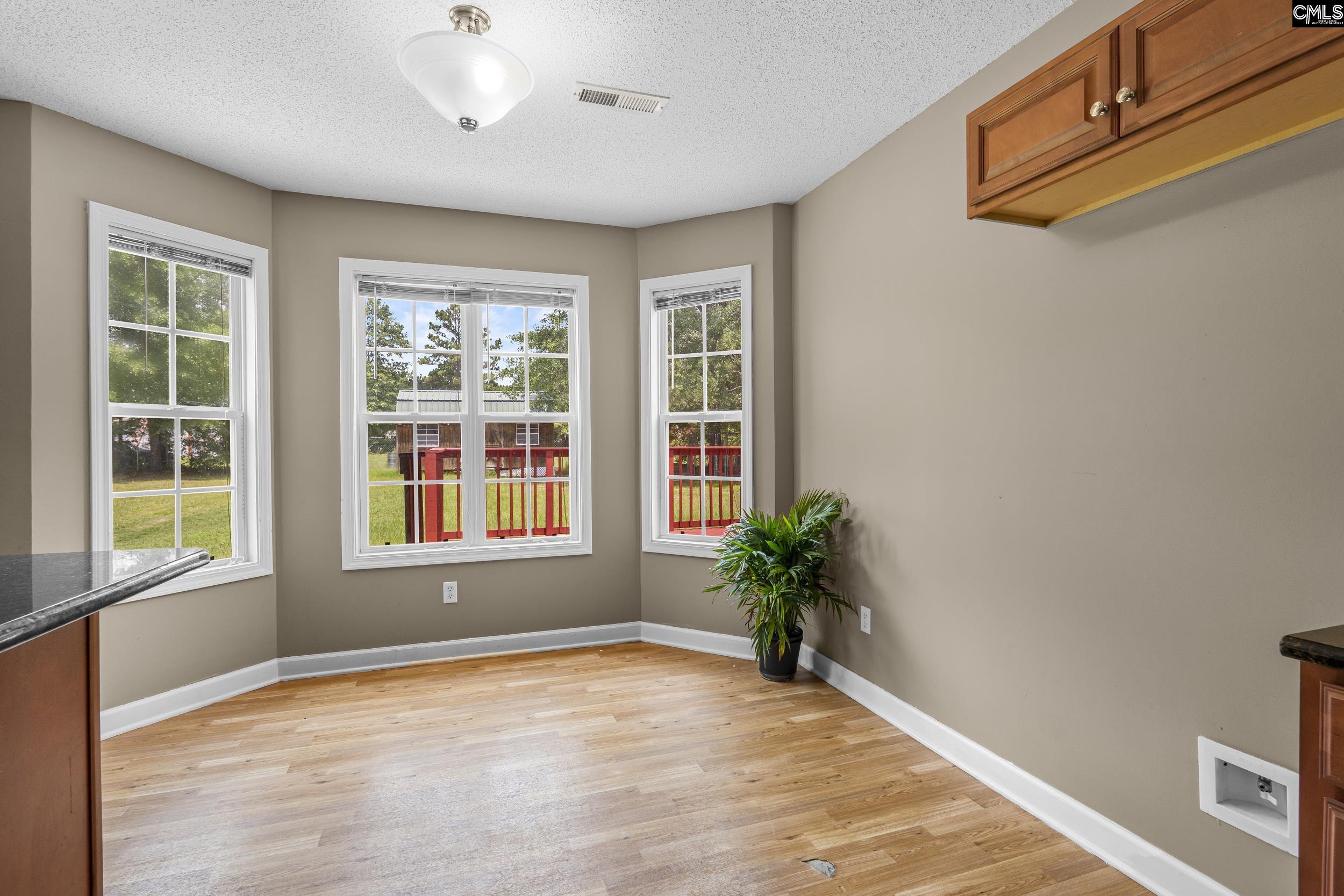 548 Eskie Dixon Road Elgin, SC 29045 - Photo 10 of 27 a view of an empty room with a window