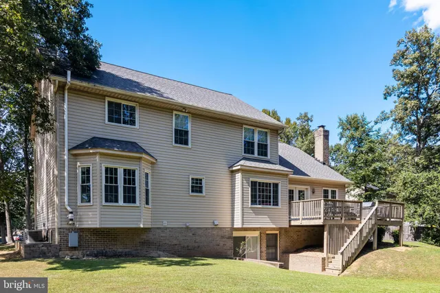 a front view of a house with yard and garage
