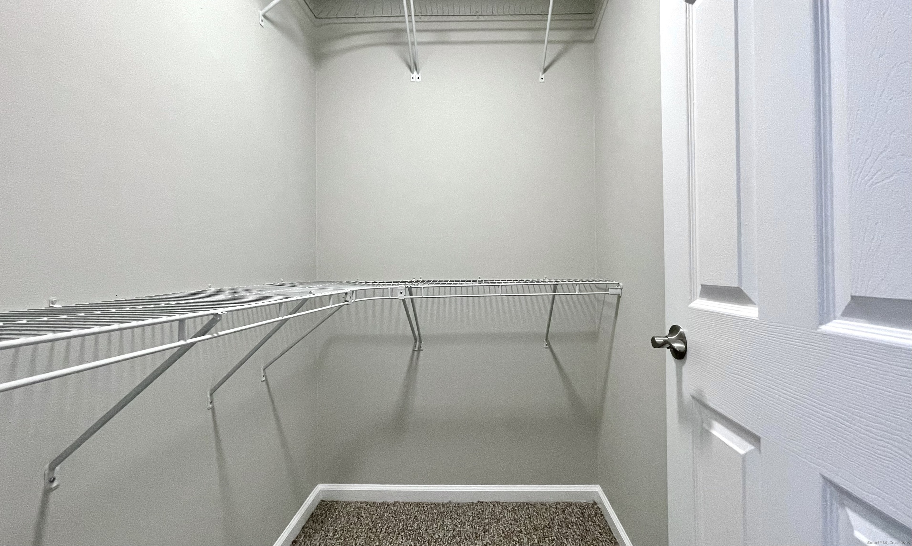 68 West Main Street Milford, CT 06460 - Photo 8 of 13 a view of walk in closet with clothes