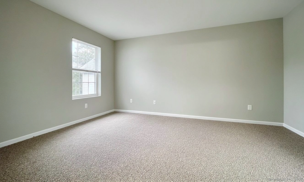 68 West Main Street Milford, CT 06460 - Photo 9 of 13 an empty room with windows