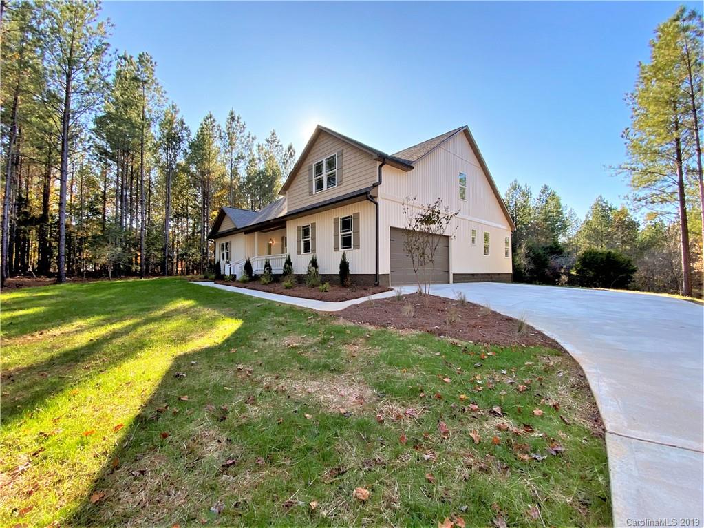 1501 Sierra Road York, SC 29745 - Photo 2 of 47 a view of a house with a big yard potted plants and large tree