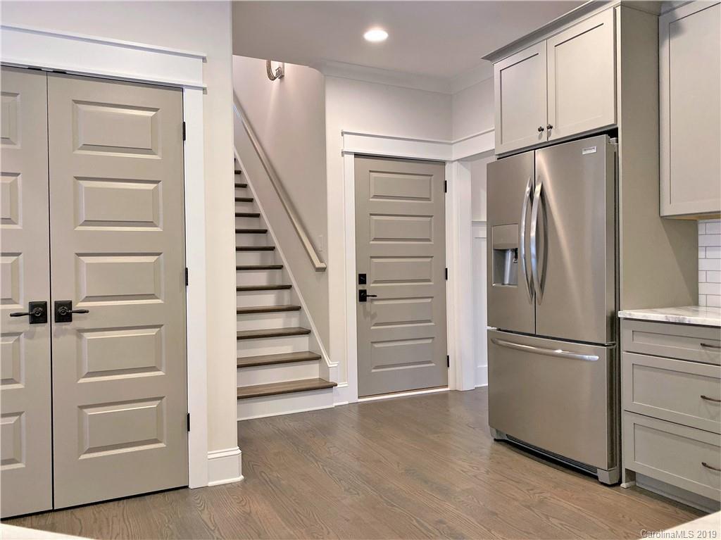 1501 Sierra Road York, SC 29745 - Photo 14 of 47 a view of hallway with stairs and wooden floor