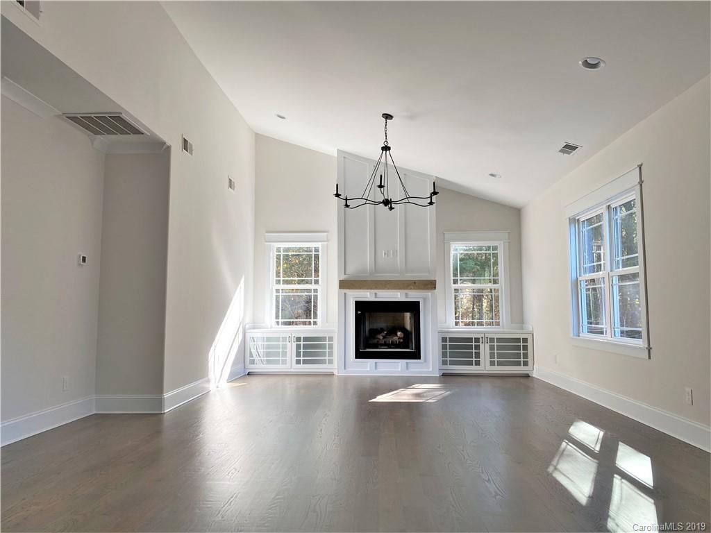 1501 Sierra Road York, SC 29745 - Photo 18 of 47 a view of an empty room with wooden floor fireplace and a window