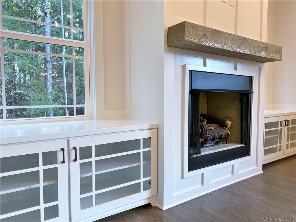 1501 Sierra Road York, SC 29745 - Photo 20 of 47 a living room with a fireplace cabinet and a large window