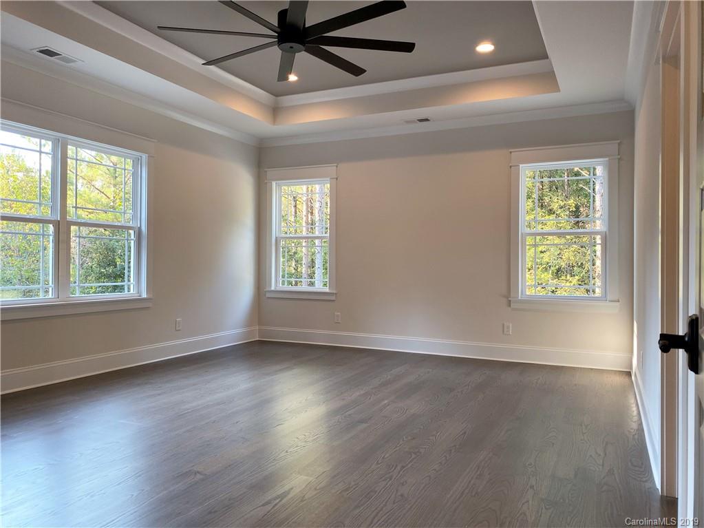 1501 Sierra Road York, SC 29745 - Photo 23 of 47 an empty room with wooden floor fan and windows