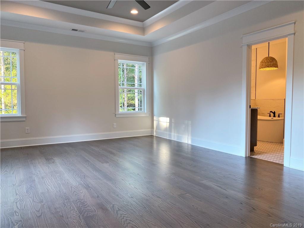 1501 Sierra Road York, SC 29745 - Photo 24 of 47 an empty room with wooden floor and a window