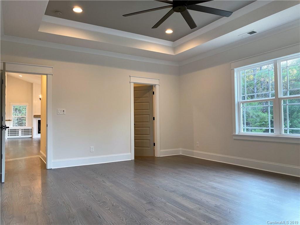1501 Sierra Road York, SC 29745 - Photo 25 of 47 an empty room with wooden floor and windows