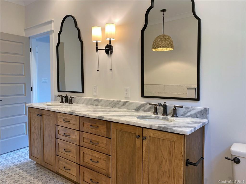 1501 Sierra Road York, SC 29745 - Photo 30 of 47 a bathroom with a double vanity sink and a mirror