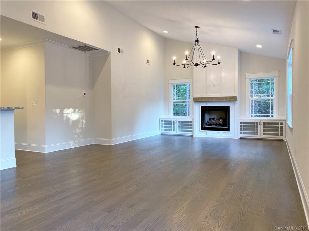 1501 Sierra Road York, SC 29745 - Photo 33 of 47 an empty room with wooden floor fireplace cabinet and windows