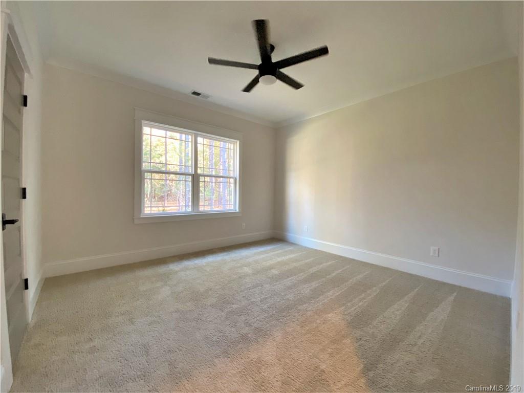 1501 Sierra Road York, SC 29745 - Photo 37 of 47 an empty room with a ceiling fan and window