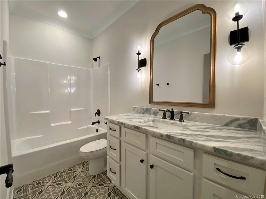 1501 Sierra Road York, SC 29745 - Photo 39 of 47 a bathroom with a granite countertop sink toilet and shower