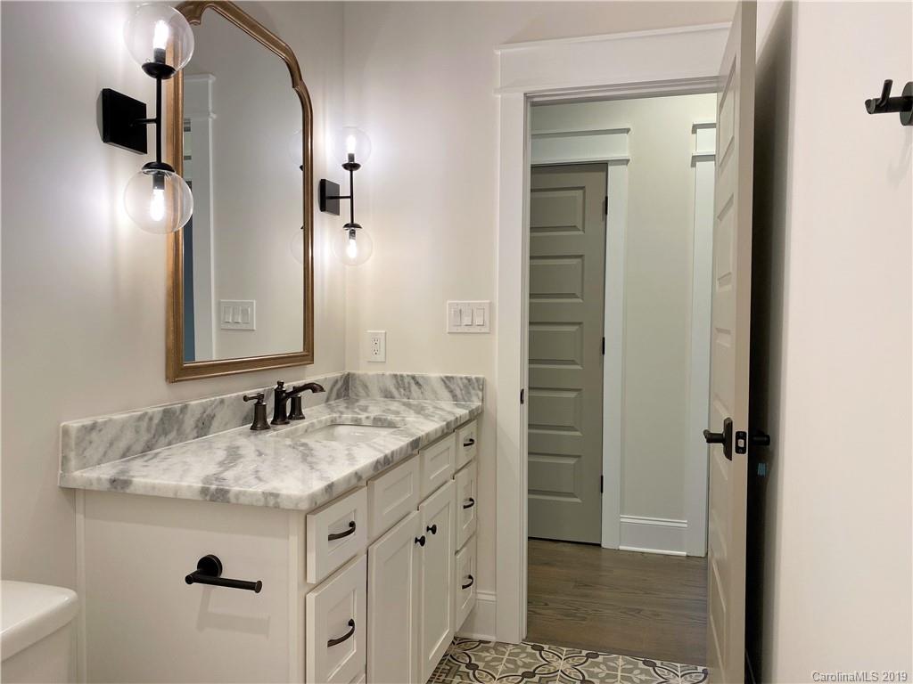 1501 Sierra Road York, SC 29745 - Photo 40 of 47 a bathroom with a granite countertop sink and a mirror