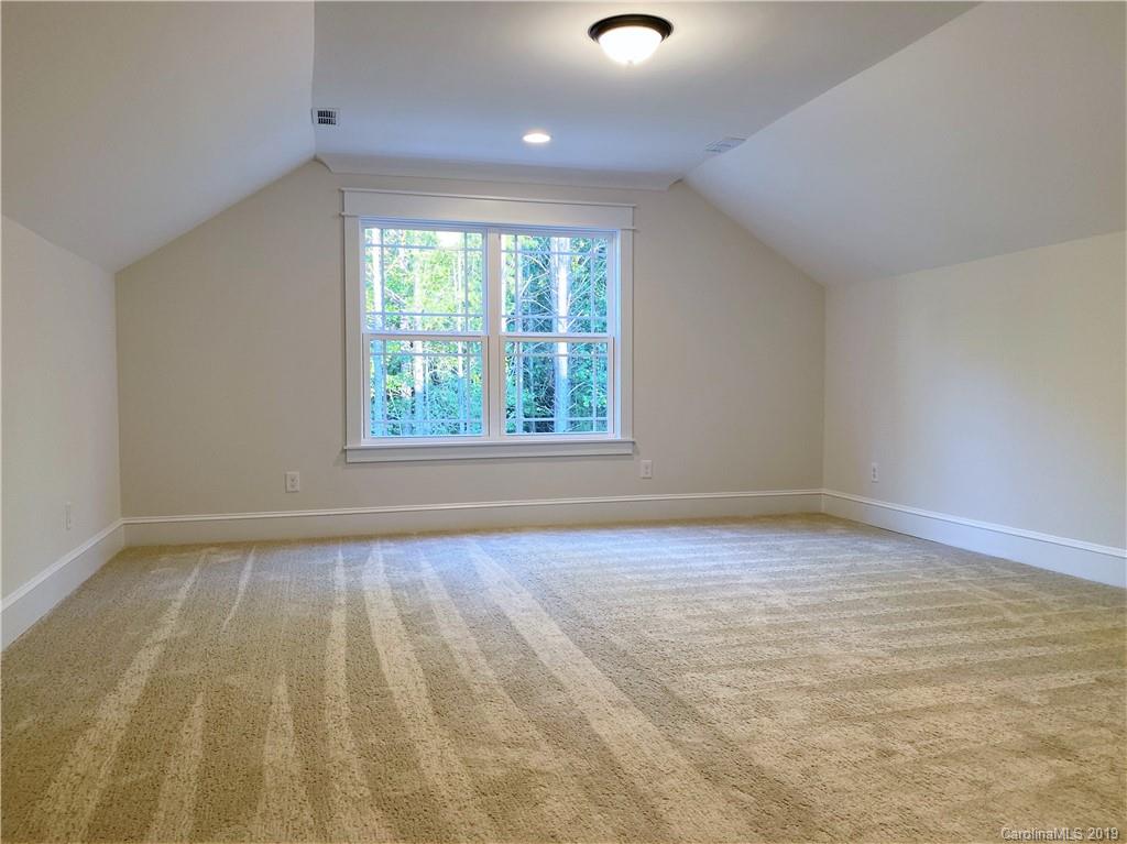 1501 Sierra Road York, SC 29745 - Photo 44 of 47 an empty room with wooden floor and windows