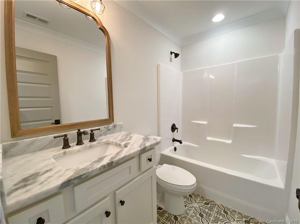 1501 Sierra Road York, SC 29745 - Photo 46 of 47 a bathroom with a granite countertop toilet sink and mirror