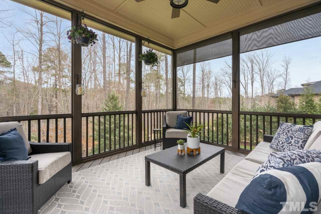 12212 Kyle Abbey Lane Raleigh, NC 27613 - Photo 14 of 30 a balcony with furniture and a potted plant
