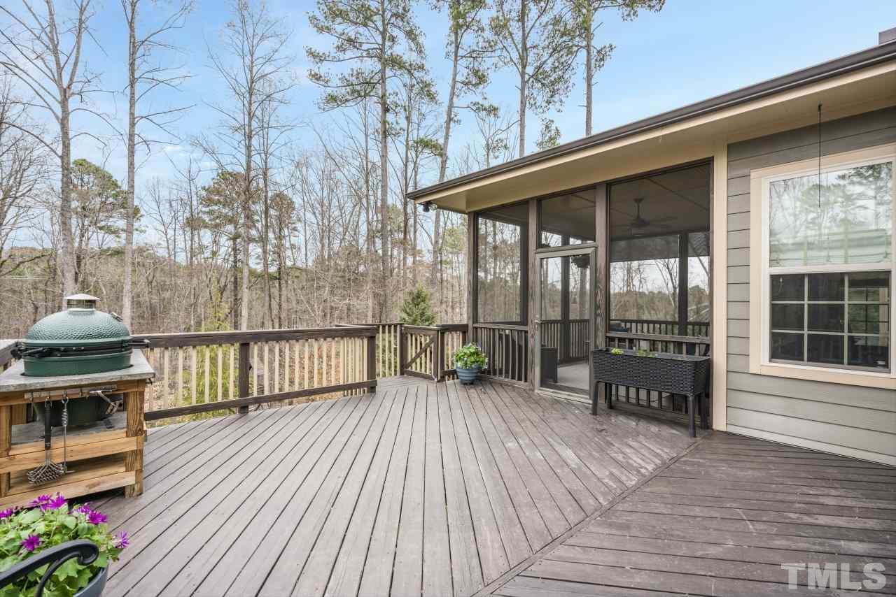 12212 Kyle Abbey Lane Raleigh, NC 27613 - Photo 15 of 30 a balcony with furniture and wooden floor