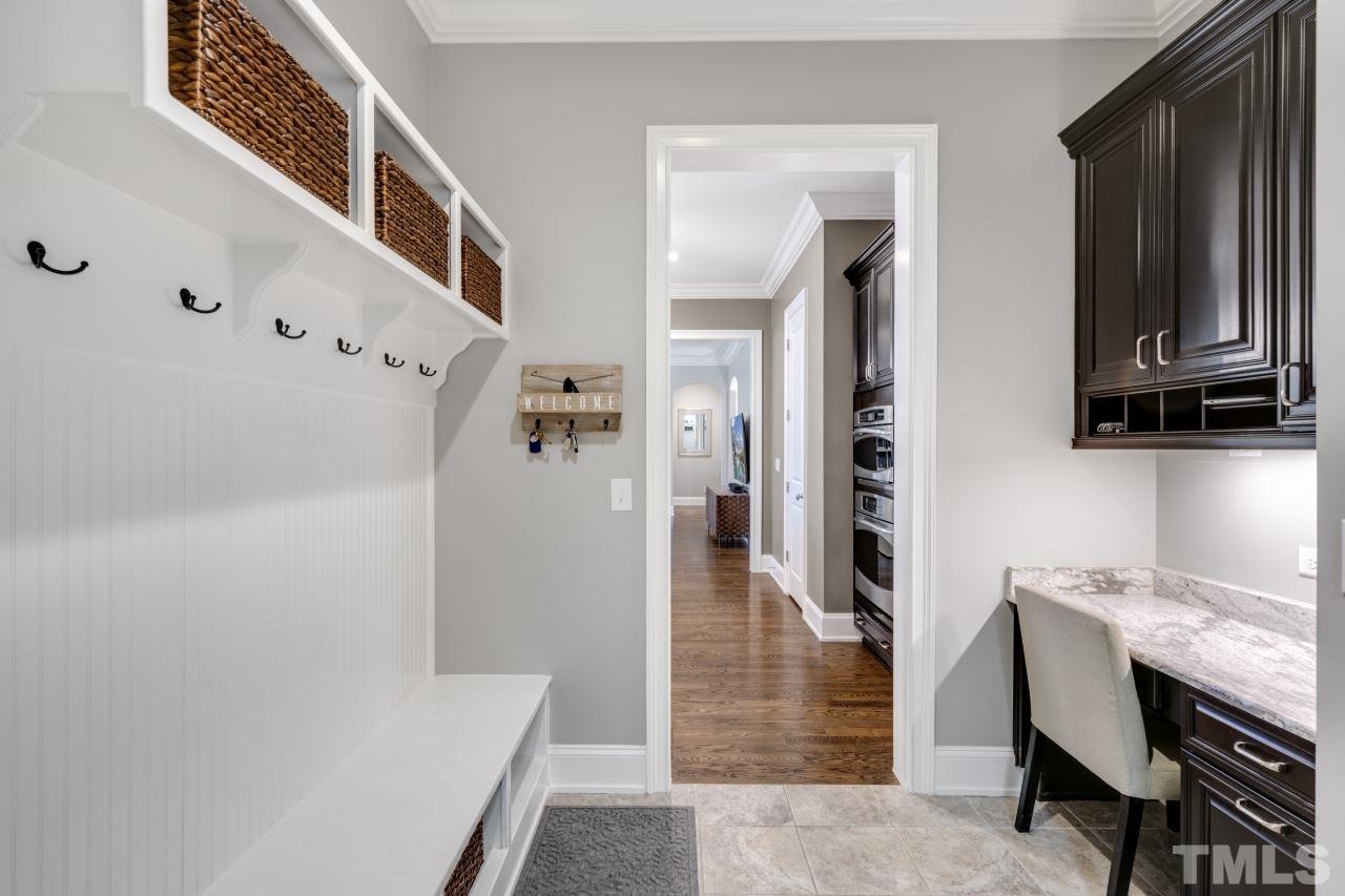 12212 Kyle Abbey Lane Raleigh, NC 27613 - Photo 20 of 30 a hallway with cabinets