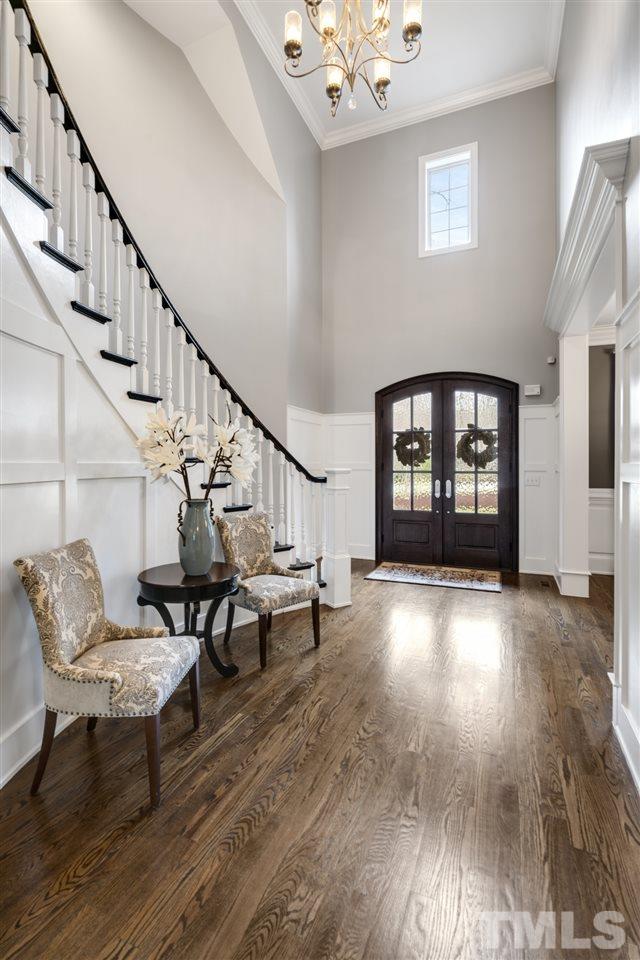 12212 Kyle Abbey Lane Raleigh, NC 27613 - Photo 3 of 30 a view of an entryway with wooden floor and a window