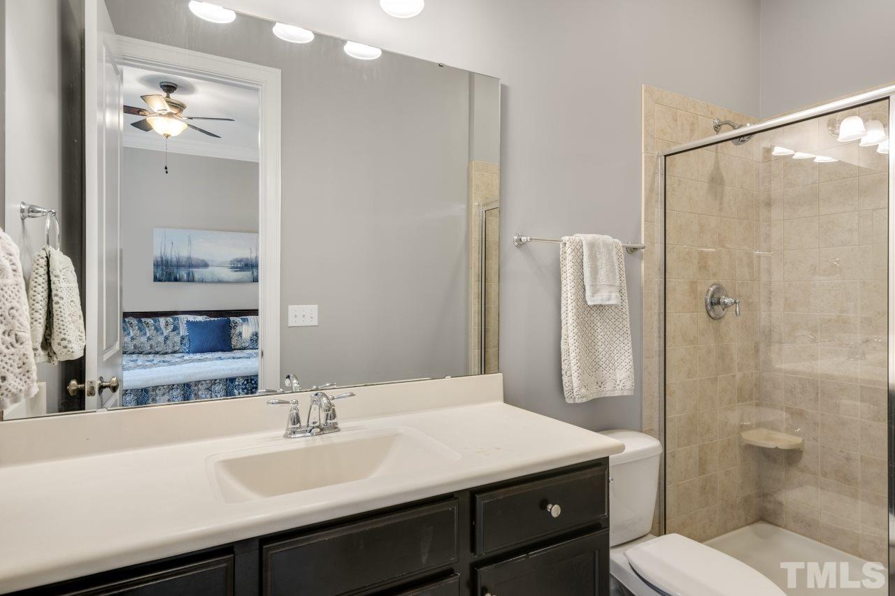 12212 Kyle Abbey Lane Raleigh, NC 27613 - Photo 22 of 30 a bathroom with a sink toilet and shower
