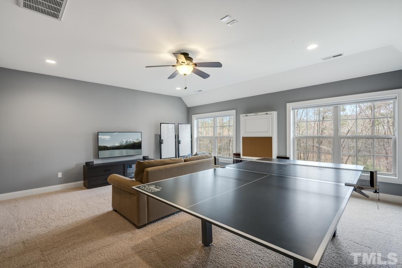12212 Kyle Abbey Lane Raleigh, NC 27613 - Photo 23 of 30 a view of kitchen and dining room with wooden floor