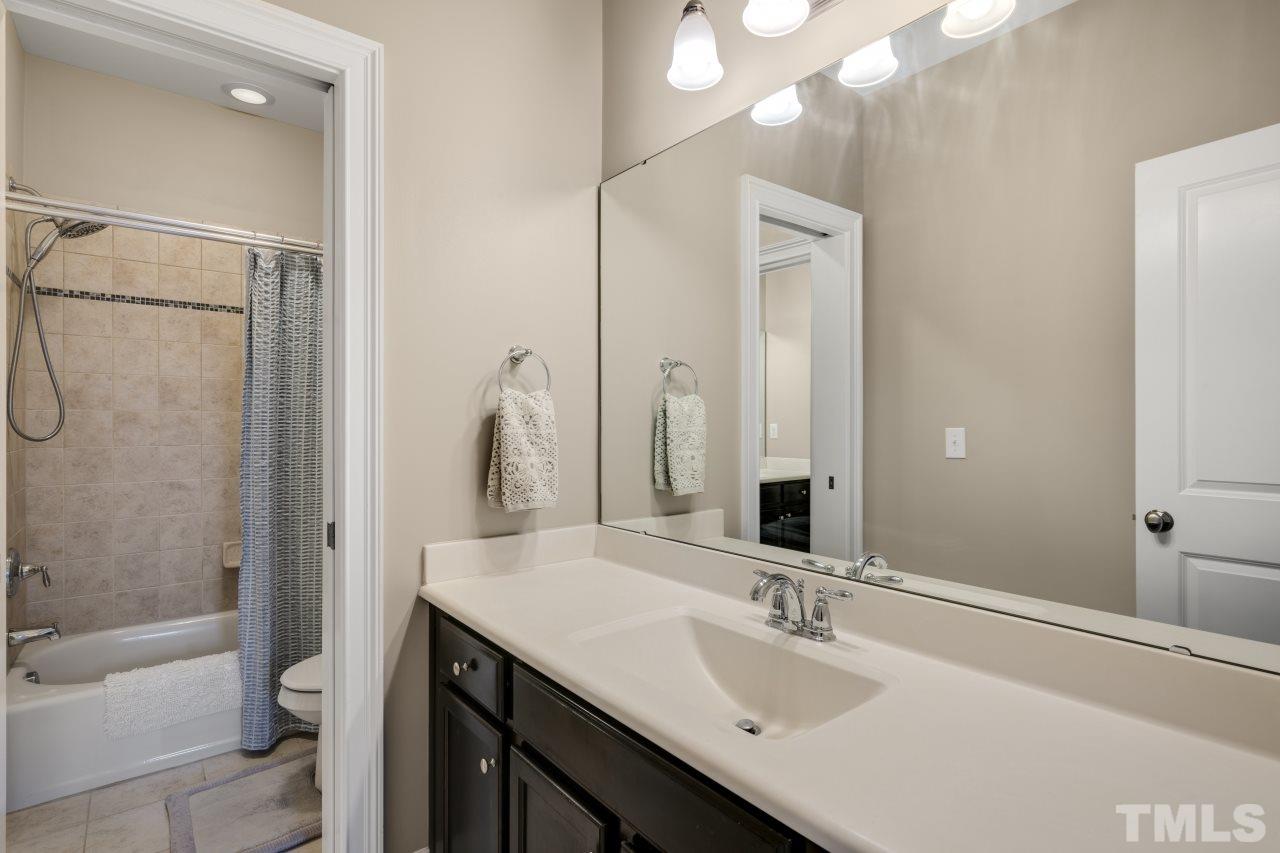 12212 Kyle Abbey Lane Raleigh, NC 27613 - Photo 28 of 30 a bathroom with a sink and a mirror