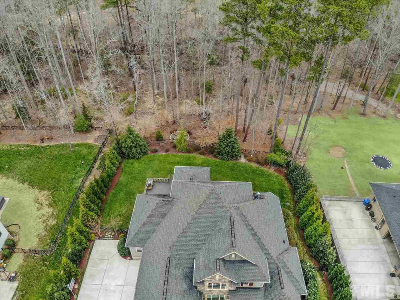 12212 Kyle Abbey Lane Raleigh, NC 27613 - Photo 29 of 30 an aerial view of a house with a yard basket ball court and outdoor seating