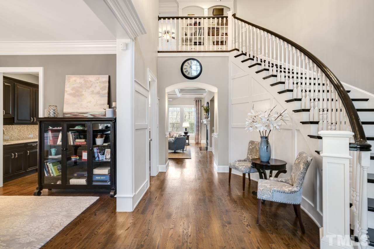 12212 Kyle Abbey Lane Raleigh, NC 27613 - Photo 4 of 30 a view of entryway and hall with wooden floor
