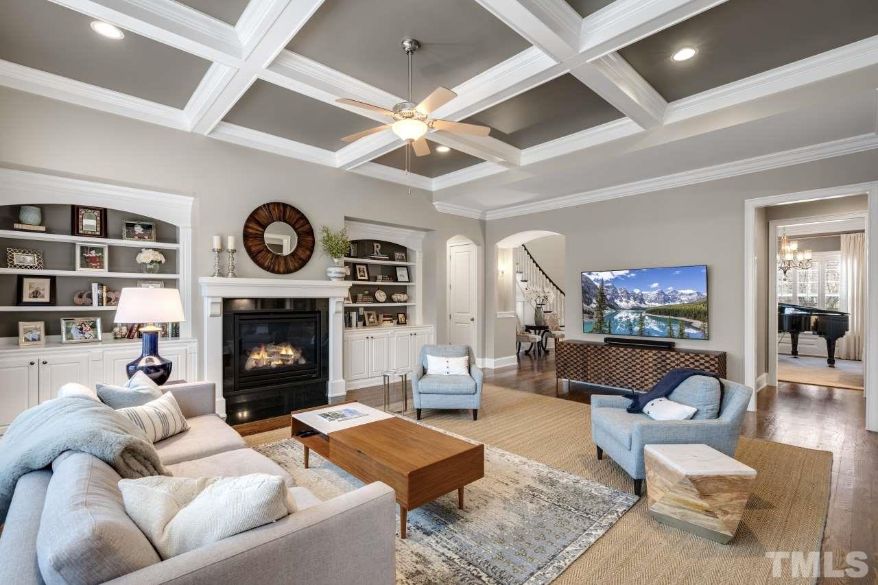 12212 Kyle Abbey Lane Raleigh, NC 27613 - Photo 7 of 30 a living room with furniture and a fireplace