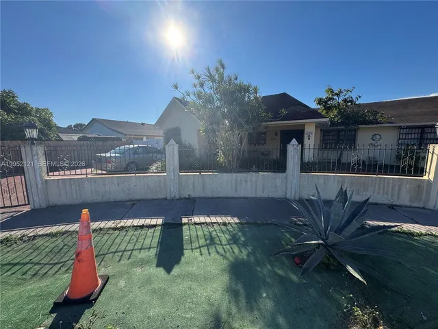 a house view with a garden space