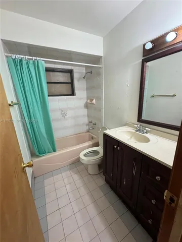 a bathroom with a double vanity sink and mirror