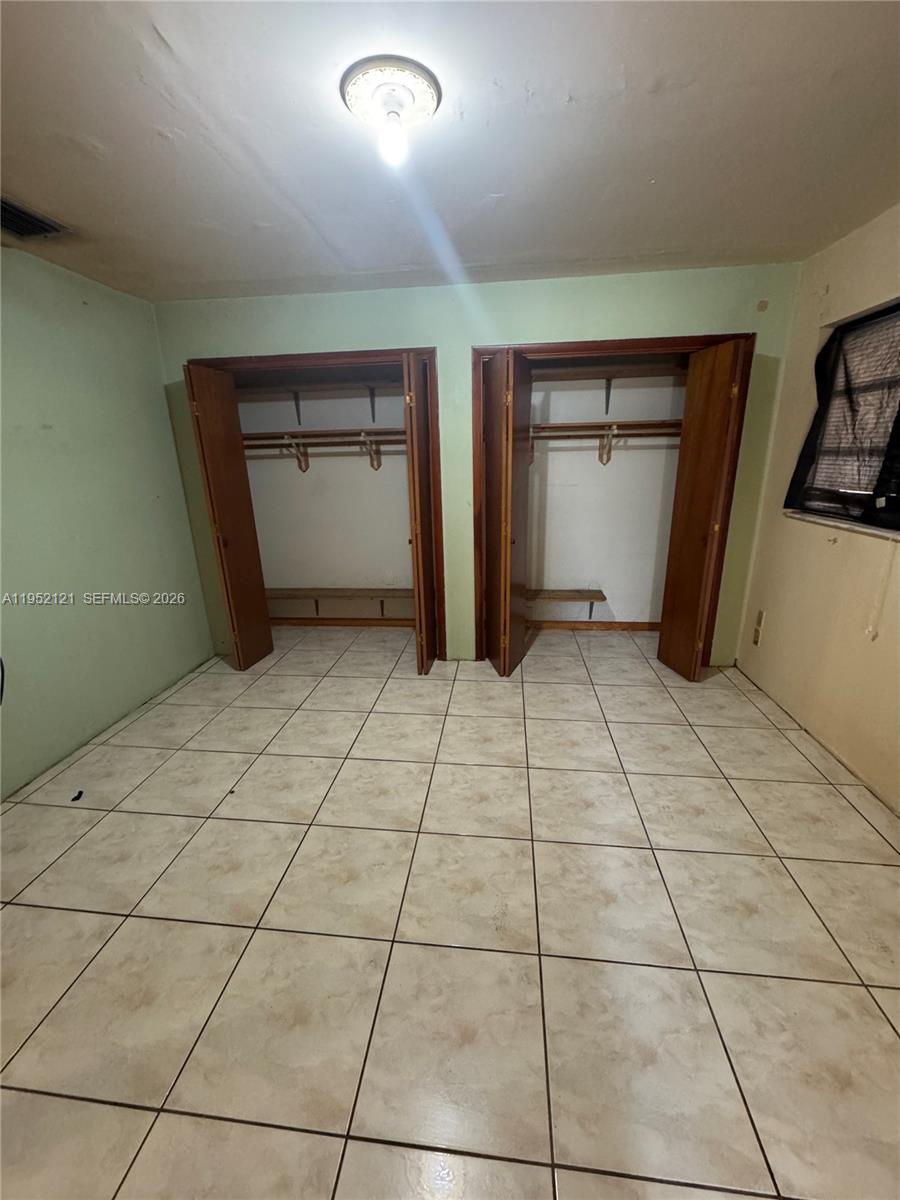 530 Southwest 101st Court Miami, FL 33174 - Photo 5 of 7 a view of an empty room and bathroom