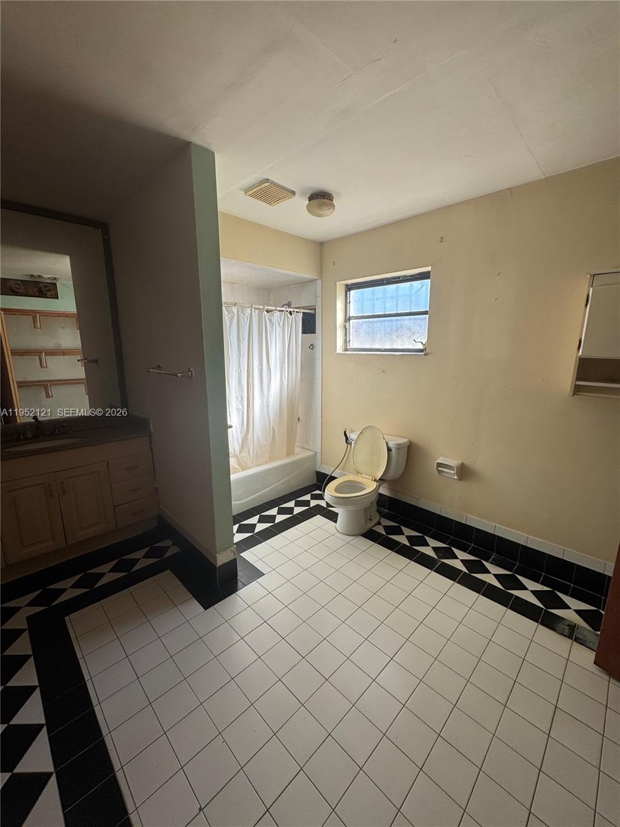 530 Southwest 101st Court Miami, FL 33174 - Photo 6 of 7 a room with gym equipment and a window