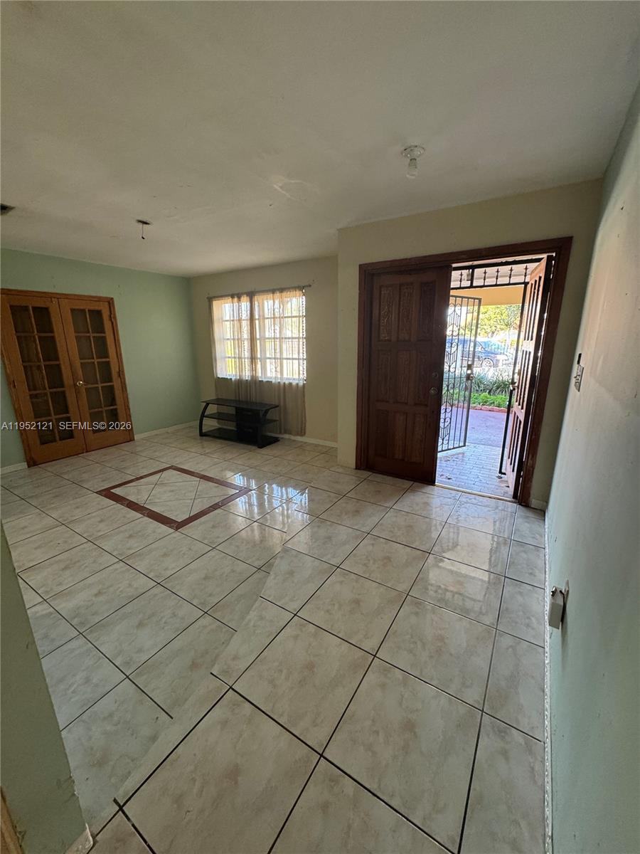 530 Southwest 101st Court Miami, FL 33174 - Photo 7 of 7 an empty room with windows