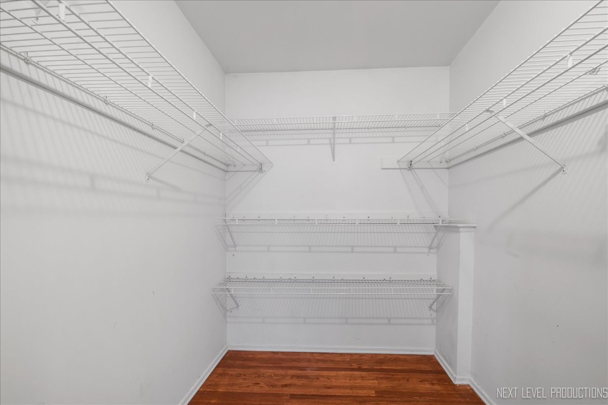 515 Hillcrest Boulevard Hoffman Estates, IL 60169 - Photo 12 of 29 a view of walk in closet with empty racks