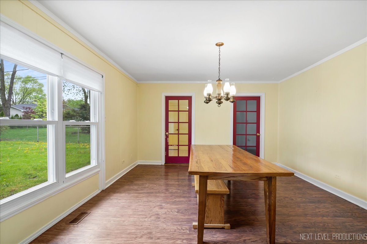 515 Hillcrest Boulevard Hoffman Estates, IL 60169 - Photo 4 of 29 a view of a dining room with furniture window and wooden floor