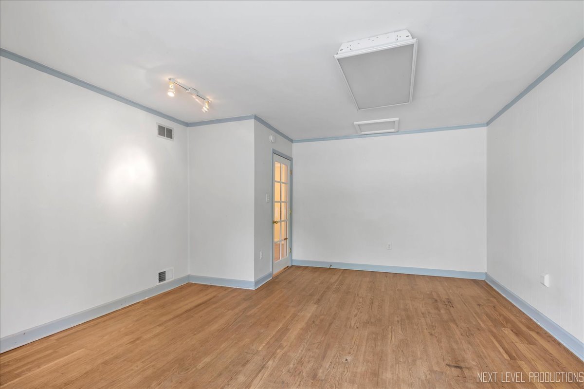 515 Hillcrest Boulevard Hoffman Estates, IL 60169 - Photo 9 of 29 wooden floor in an empty room