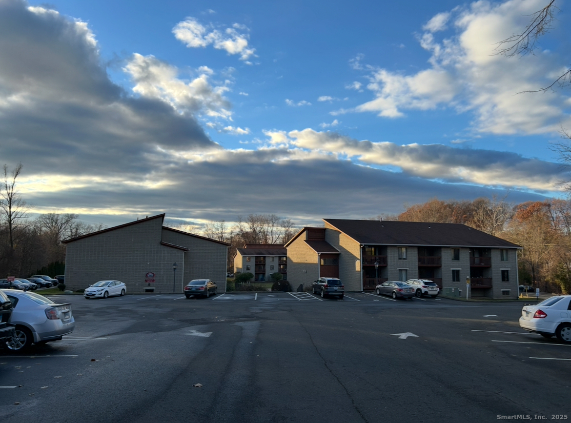 a view of multiple houses with a street