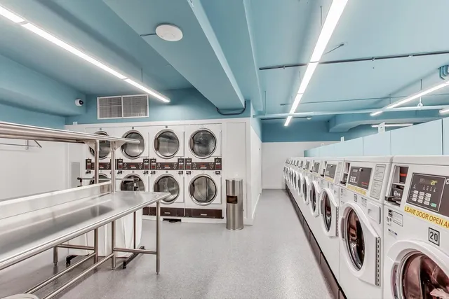a view of a hallway with washer and dryer