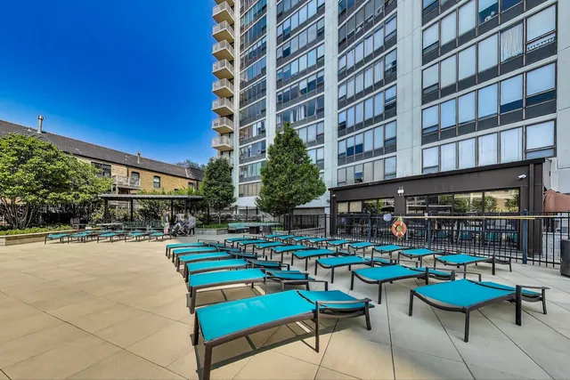 a view of a patio with a table and chairs